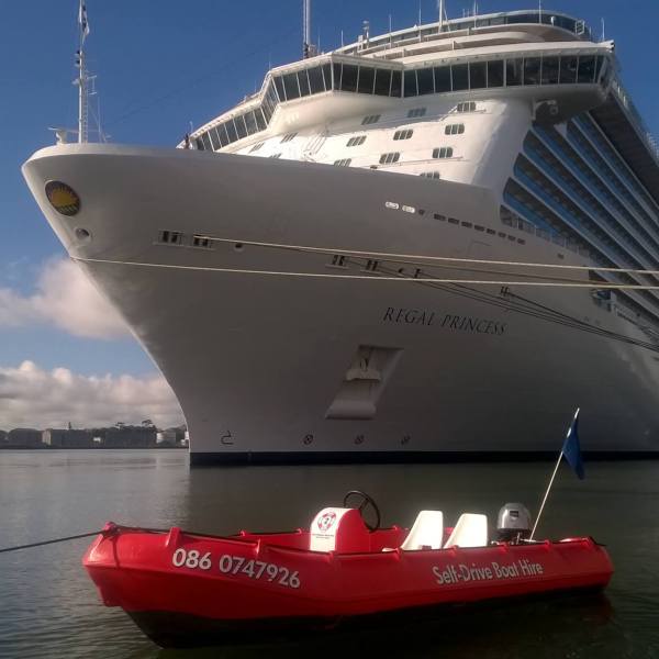 a small boat in a large body of water