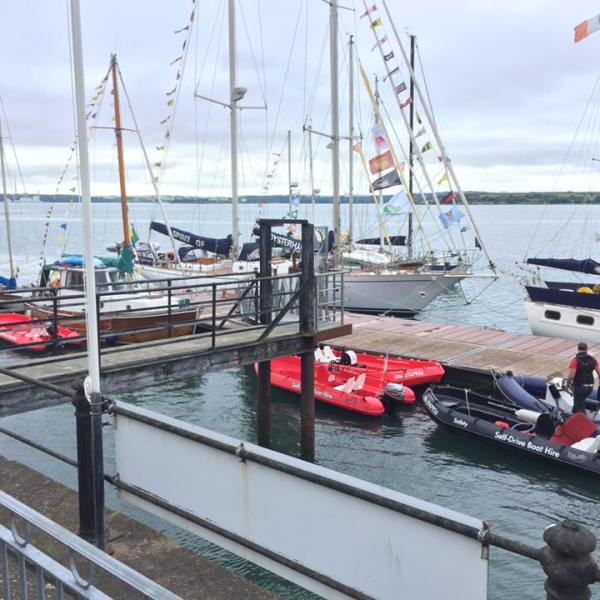 a boat is docked next to a body of water