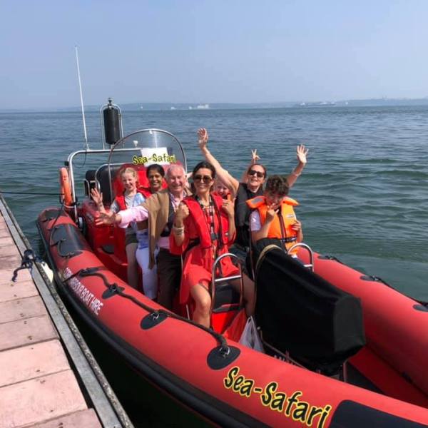 a group of people in a boat on a body of water