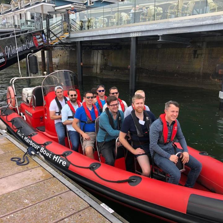 Andrei Okounkov et al. riding on the back of a boat