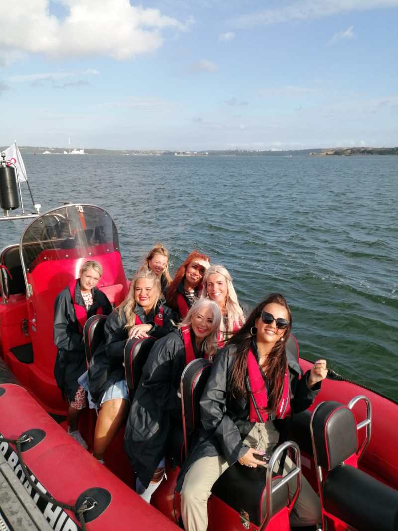 Hens & Stag 3 a group of people in a boat on a body of water